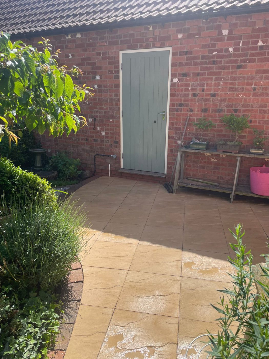 Clean path leading to a garden door