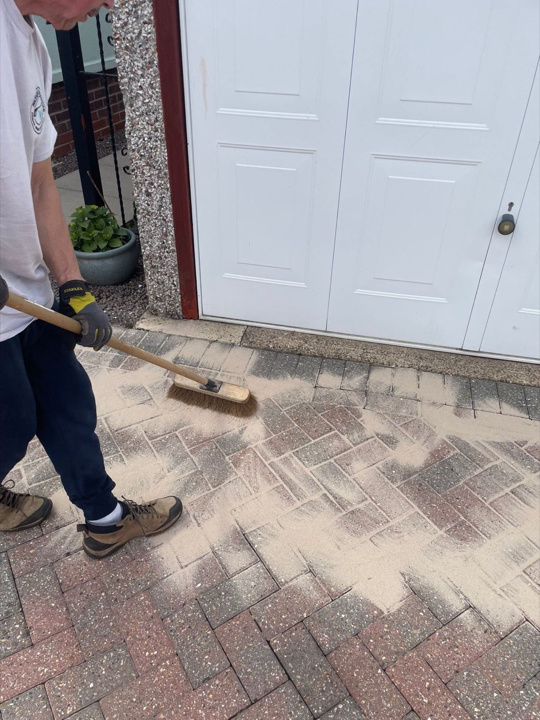 Close-up of re-sanding block paving